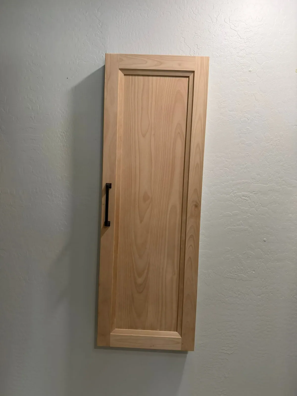 Custom cabinet door storage and tall cabinet by Ramos Cabinetry and Construction in Tempe, AZ